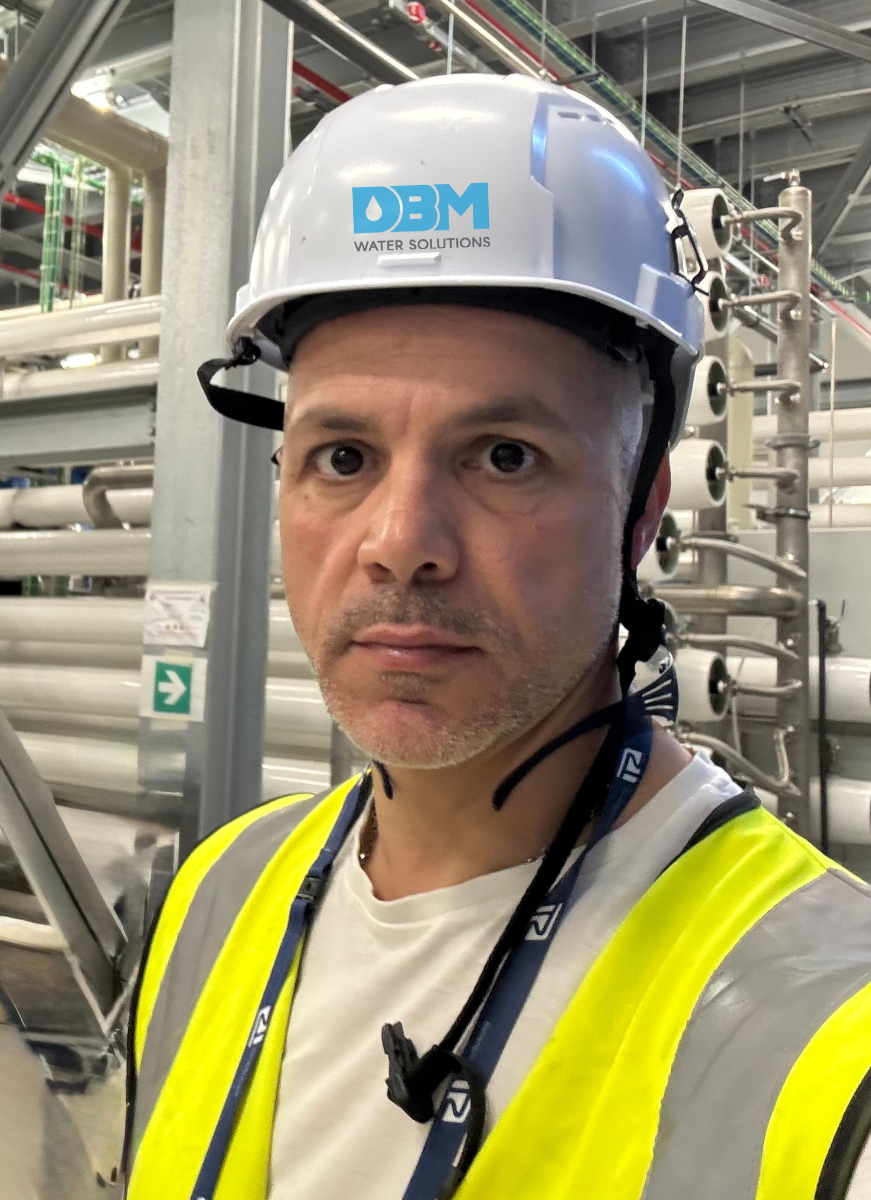 DB MAS Libya Oil Services water treatment specialist on site wearing DBM Water Solutions branded PPE